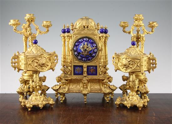 A 19th century French Henri II style three piece ormolu and porcelain clock garniture, 8.25in.